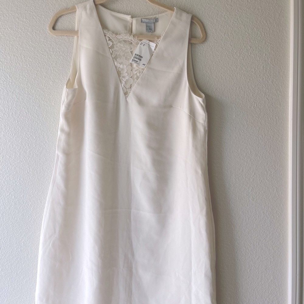 Elegant H&M cream color shift dress. New with tag. Size 10